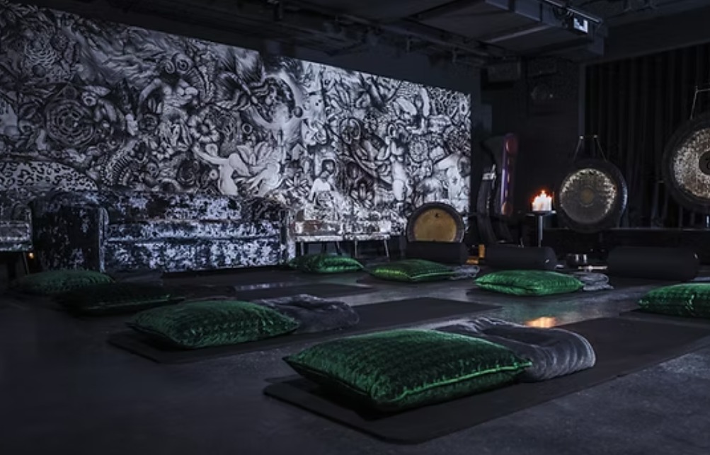 The breathwork room at The Mandrake, Fitzrovia, with gongs and cushions laid out